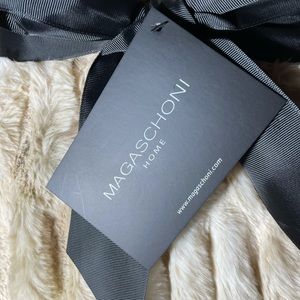 Magaschoni faux fur 50”x 60” tan throw.